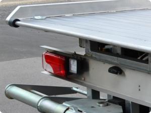 Close up of aluminium side raves and aluminium plank floor