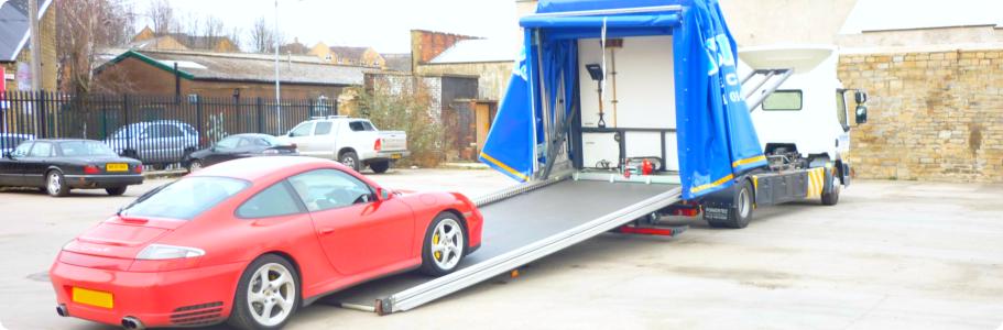 Extended Tilt and Slide Transporter showing a car being loaded